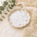 Handmade plantable wildflower seed paper hearts displayed in a bowl, ready for eco-friendly favours, gifts and creative projects.