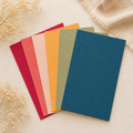 Handmade coloured seed paper sheets with embedded wildflower seeds, perfect for eco-friendly crafts, personalised stationery, gift tags and creative paper projects.