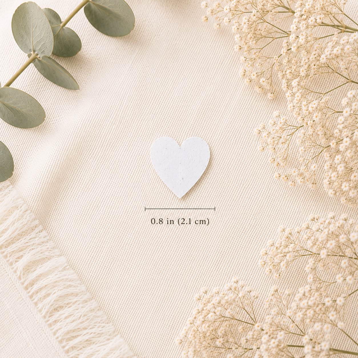 Size guide showing small plantable seed paper hearts handmade with wildflower seeds for baby shower favours, wedding gifts and eco-friendly events.